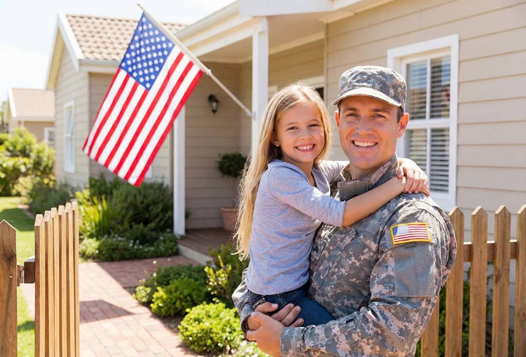 Veteran parent with child smiling outside